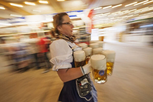 Germany, Bavaria, Munich, Oktoberfest, Waitress with Beer Steins