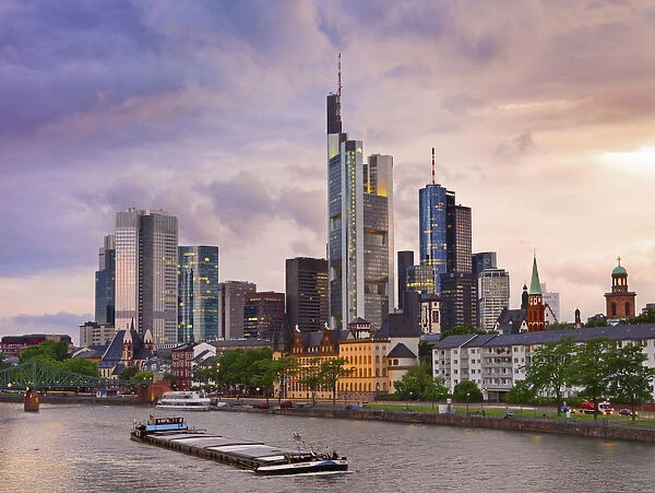 Germany, Hessen, Frankfurt Am Main, Financial district, Boat on river Main at dusk