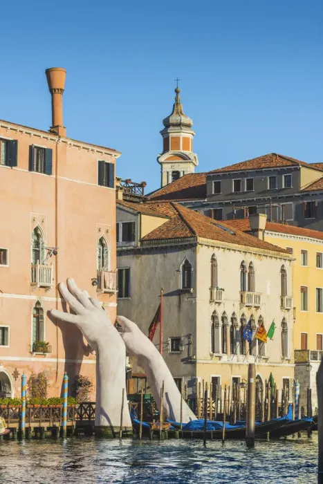 Framed Print : The giant hands rising from the water, an artwork by Lorenzo Quinn. Venice, Veneto, Italy