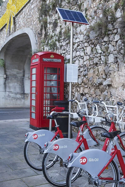 Gibraltar, Gibraltar, British red telephone box and hire bikes by Southport Gates