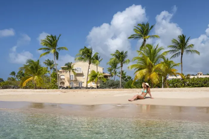Framed Print : Girl sunbathes on the beach facing the turquoise water of the Caribbean sea Framed Print : Girl sunbathes on the beach facing the turquoise water of the Caribbean sea