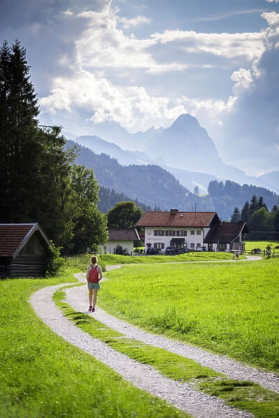 A girl walking on the path to Gerold Village, near Garmisch Partenkirken, Bayern Alps