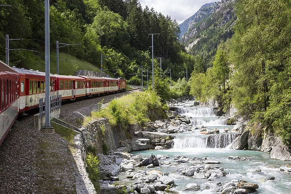 Glacier Express train climbing towards Zermatt, Valais, Switzerland