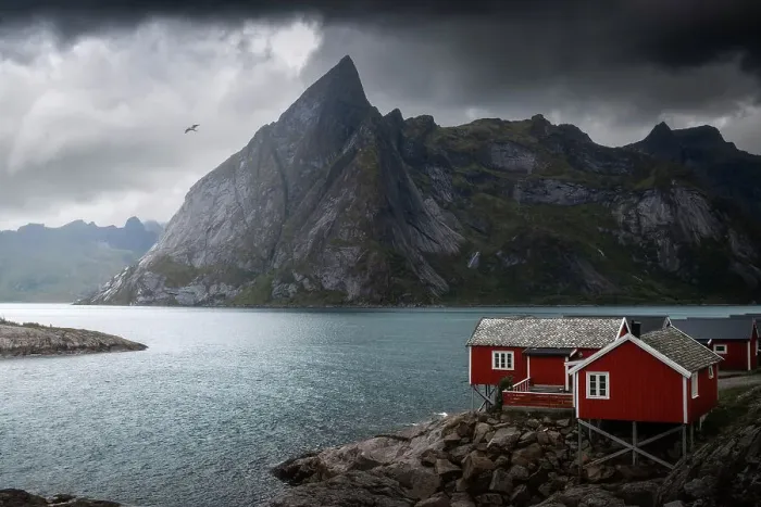 Framed Print : A gloomy afternoon at Hamnoy, with the classic red cabins and the rugged mountains in the background. Lofoten Islands, Norway Framed Print : A gloomy afternoon at Hamnoy, with the classic red cabins and the rugged mountains in the background. Lofoten Islands, Norway