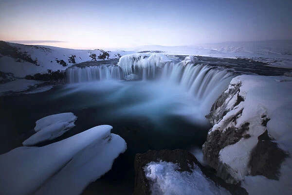 Godafoss waterfall during a cold sunrise in winter, Nordurland, Iceland