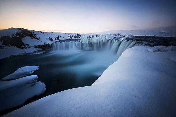 Godafoss waterfall during a cold sunrise in winter, Nordurland, Iceland