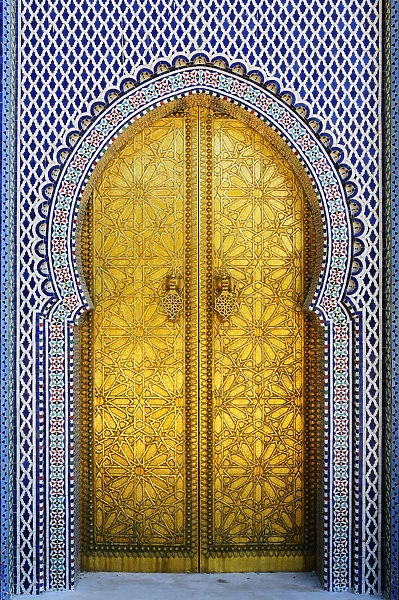 Gold and tile work of the royal palace door in Fes. Morocco