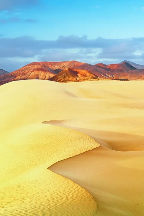 Framed Print : Golden sand dunes with volcanic mountains on background at dawn, Corralejo Natural Park, Fuerteventura, Canary Islands, Spain Framed Print : Golden sand dunes with volcanic mountains on background at dawn, Corralejo Natural Park, Fuerteventura, Canary Islands, Spain