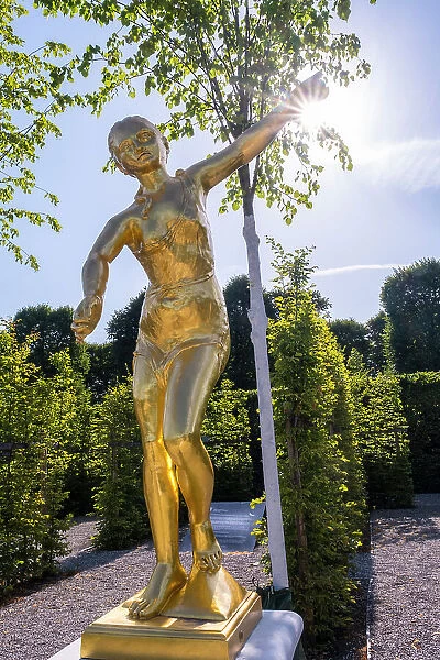 Golden statues in the gardens of Schloss Herrenhausen, Hannover, Lower Saxony, Germany