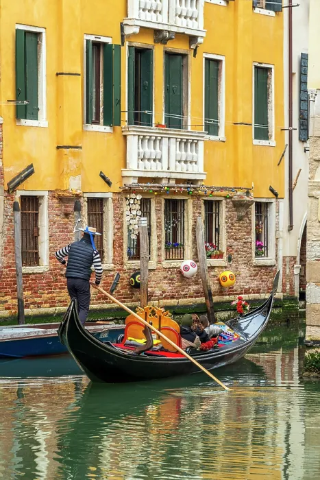 Framed Print : Gondolier and gondola boat in a small water canal, Venice, Veneto, Italy Framed Print : Gondolier and gondola boat in a small water canal, Venice, Veneto, Italy