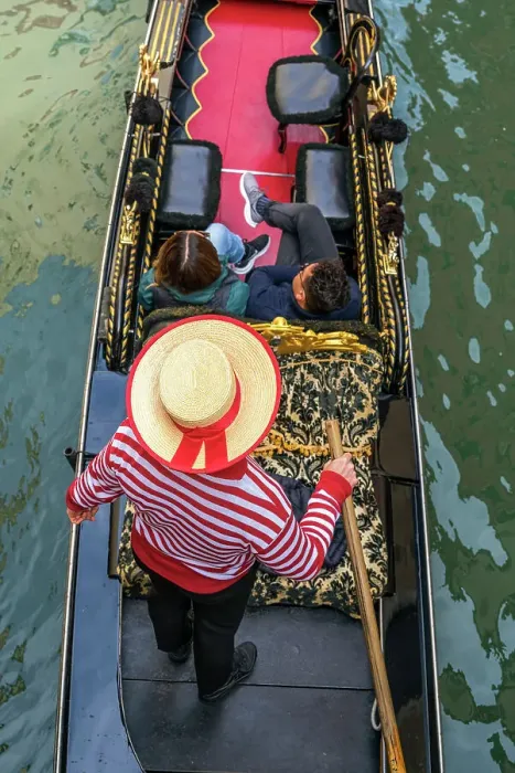 Framed Print : Gondolier with hat on gondola boat in a water canal, Venice, Veneto, Italy Framed Print : Gondolier with hat on gondola boat in a water canal, Venice, Veneto, Italy