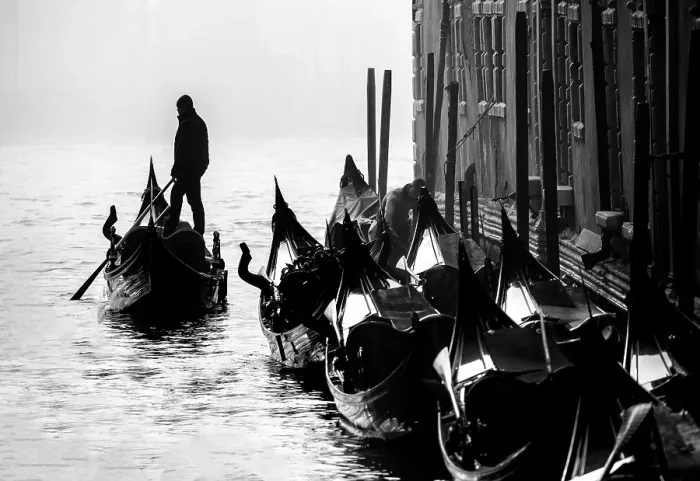 Framed Print : Gondolier in silhouette and parked gondolas, Grand Canal, Venice, Italy Framed Print : Gondolier in silhouette and parked gondolas, Grand Canal, Venice, Italy