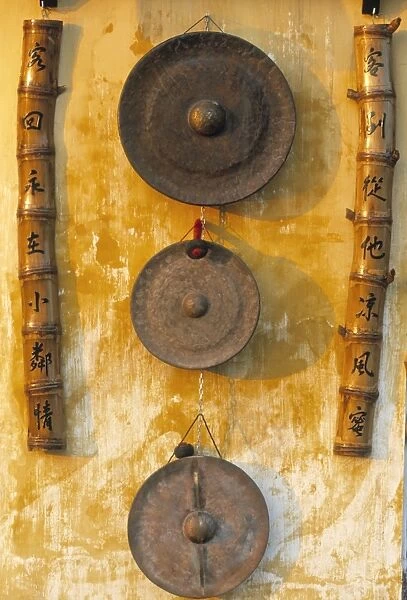 Gongs hanging on a wall
