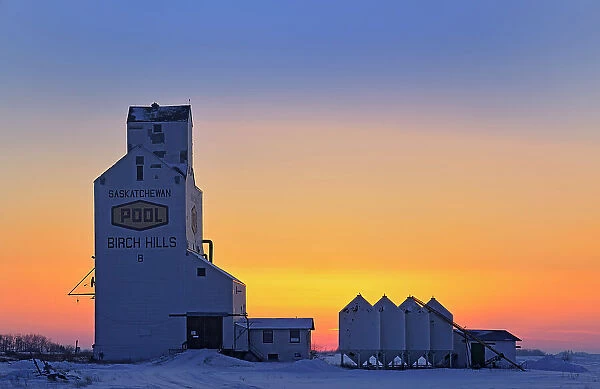 Grain elevator and bins at sunset Birch Hills Saskatchewan, Canada
