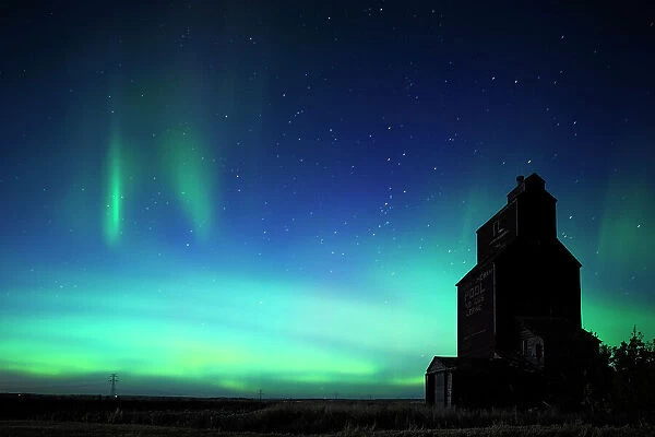 Grain elevator in ghost town with northern lights in the northern sky Lepine Saskatchewan, Canada