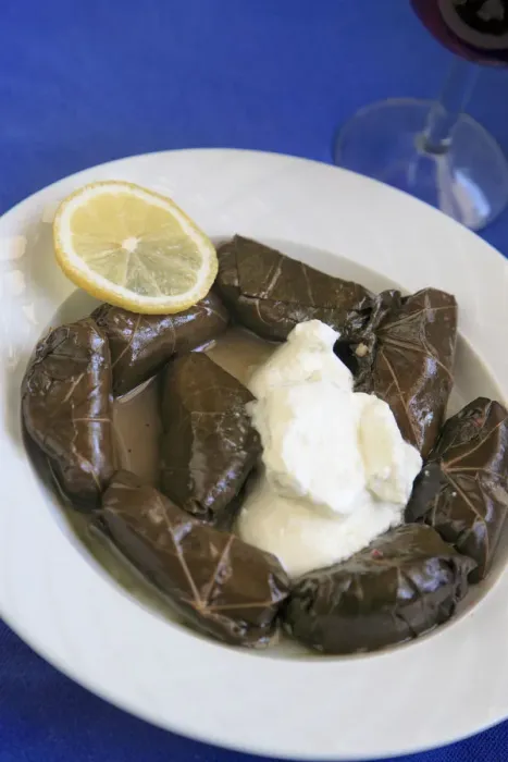 Framed Print : Greek Cuisine. Fresh Dolmades, Vine Leaves with Yogurt and glass of Red Wine