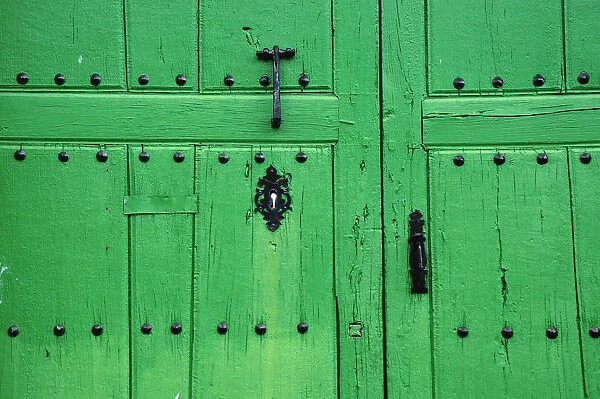 Green traditional door. Castrillo de los Polvazares, Castilla y Leon, Spain