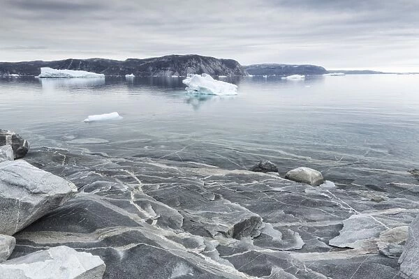 Greenland, DiskoBay, Reefs, sea with icebergs of Ataa a small village of fishermen