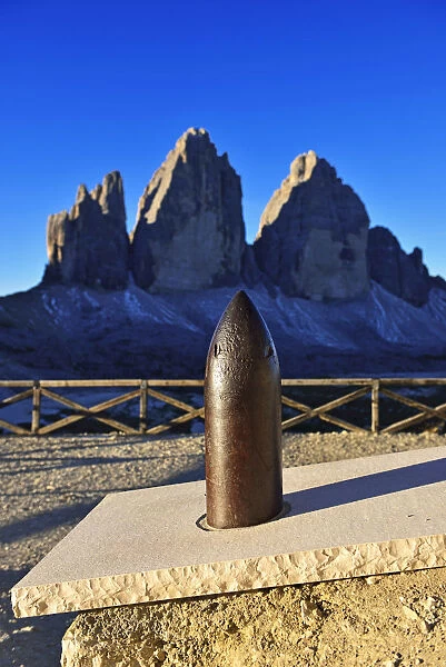 Grenade from the First World War before the Three Peaks Lodge, in the background the