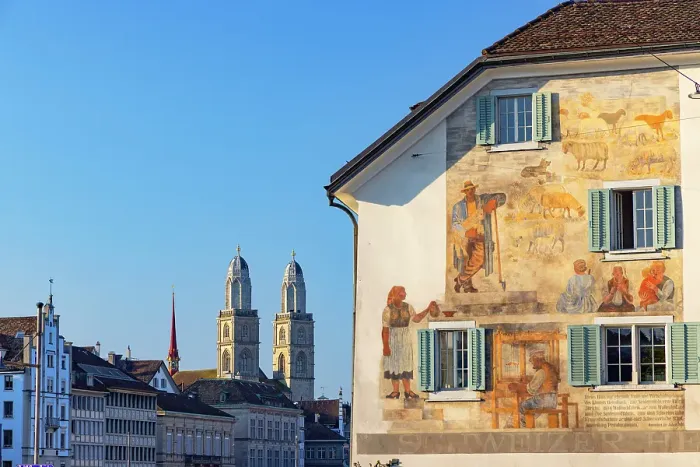 Framed Print : Grossmunster and mural on building, Zurich, Switzerland Framed Print : Grossmunster and mural on building, Zurich, Switzerland