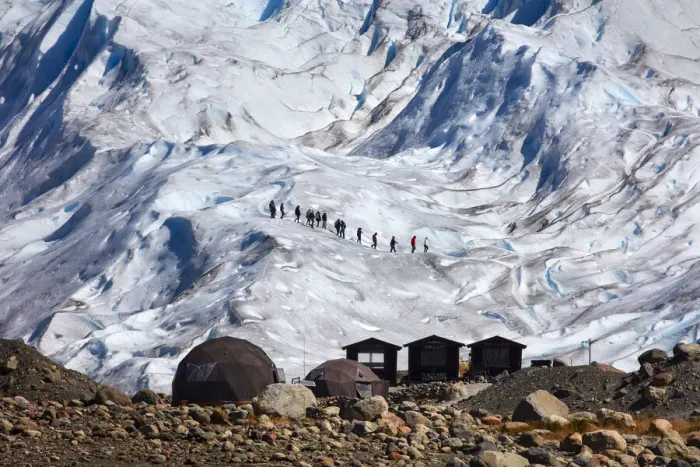Framed Print : A group of tourists walk on the surface of the Perito Moreno Glacier, Southern Patagonian Ice Field, El Calafate, Argentina Framed Print : A group of tourists walk on the surface of the Perito Moreno Glacier, Southern Patagonian Ice Field, El Calafate, Argentina