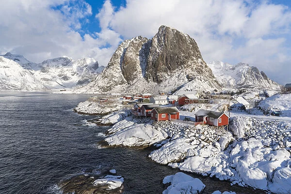 Hamnoy village covered in snow, with Festheltinden peak in the background