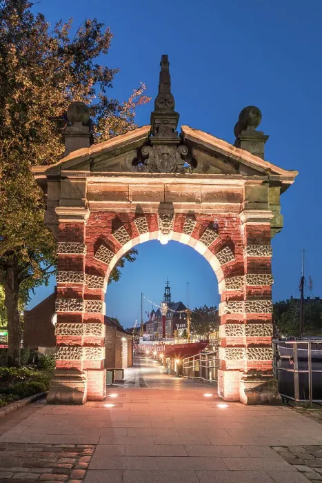 Framed Print : Harbor gate with a view of the Ratsdelft with town hall at blue hour, Emden, East Frisia, Lower Saxony, Germany Framed Print : Harbor gate with a view of the Ratsdelft with town hall at blue hour, Emden, East Frisia, Lower Saxony, Germany