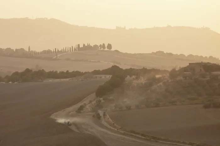 Framed Print : Hazy landscape at dusk, with tractor ploughing field, Val d'Orcia, near Pienza, Tuscany, Italy Framed Print : Hazy landscape at dusk, with tractor ploughing field, Val d'Orcia, near Pienza, Tuscany, Italy