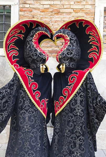 Heart-shaped costumes at the Venice Carnival, Venice, Italy