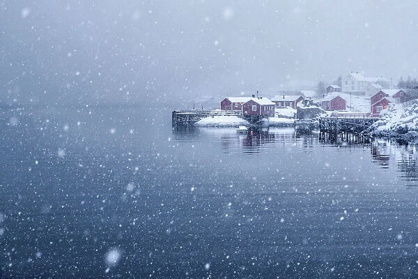 Heavy snowfall on the little village of Nusfjord. Lofoten islands. Norway