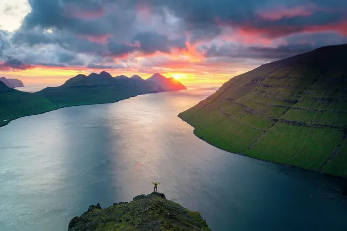 Framed Print : High angle view of cheerful hiker with arms outstretched watching sunset on mountain top, Klaksvik, Bordoy island, Faroe Islands Framed Print : High angle view of cheerful hiker with arms outstretched watching sunset on mountain top, Klaksvik, Bordoy island, Faroe Islands