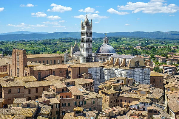 High angle view of Duomo di Siena (Siena Cathedral) and buildings in old town