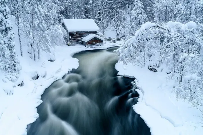 Framed Print : High angle view of icy river rapids flowing in a winter snowy forest near Myllykoski mill, Oulanka National Park, Lapland, Finland
