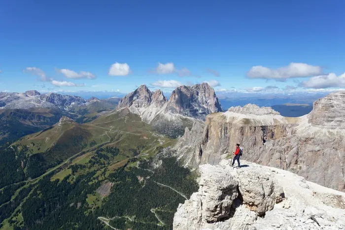 Framed Print : A hiker admires Fassa Valley and Sassolungo Group from Sass Pordoi, Sella Group, Dolomites, Canazei, Trentino - Alto Adige, Italy. (MR) Framed Print : A hiker admires Fassa Valley and Sassolungo Group from Sass Pordoi, Sella Group, Dolomites, Canazei, Trentino - Alto Adige, Italy. (MR)