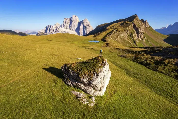 Framed Print : Hiker with backpack admiring Mount Pelmo and Baste lake, Mondeval flat, Giua pass, Cadore valley, Cortina d'Ampezzo, Dolomites, Veneto, Italy (MR)