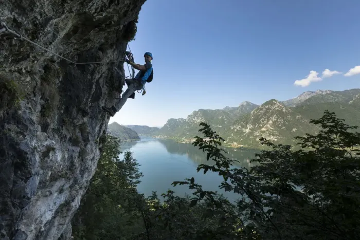 Framed Print : a hiker is climbing along the Ginestre klettersteig with the lake Idro in the background Framed Print : a hiker is climbing along the Ginestre klettersteig with the lake Idro in the background