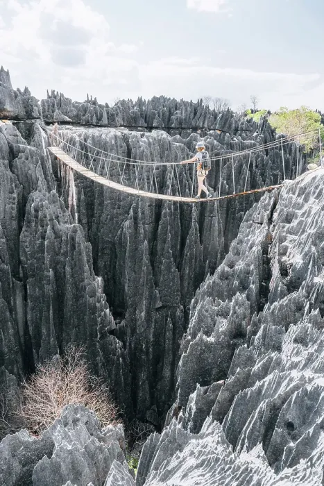 Framed Print : Hiker crosses a rope bridge. Madagascar, Africa. Tsingy De Bemaraha Framed Print : Hiker crosses a rope bridge. Madagascar, Africa. Tsingy De Bemaraha