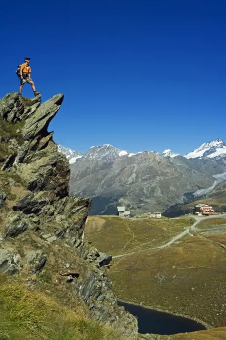 Framed Print : Hiker high on trail above lake at Schwarzee Paradise (MR)