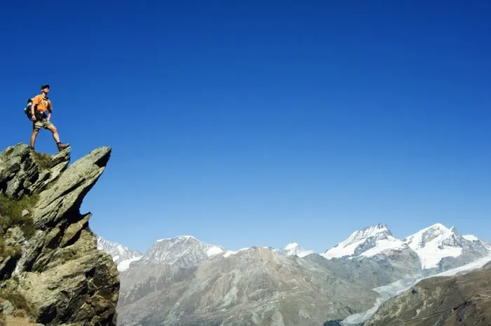 Framed Print : Hiker high on trail above snow capped mountains (MR) Framed Print : Hiker high on trail above snow capped mountains (MR)