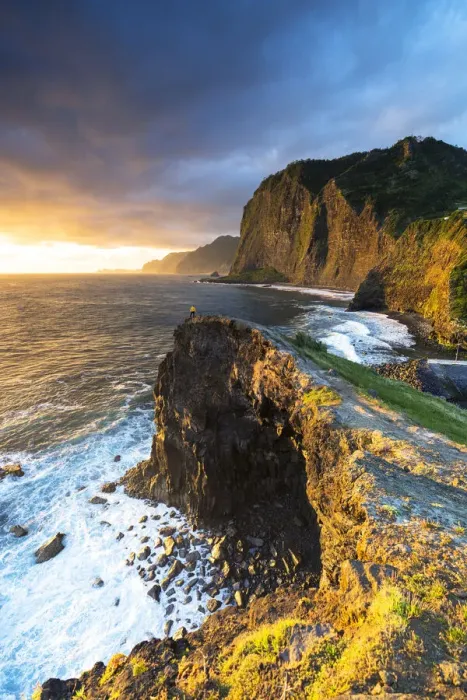 Framed Print : Hiker looking at the crashing waves at dawn from cliffs, Madeira, Portugal (MR) Framed Print : Hiker looking at the crashing waves at dawn from cliffs, Madeira, Portugal (MR)