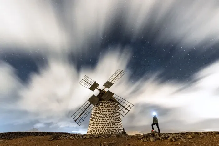 Framed Print : Hiker man with head torch admiring clouds in the starry sky over the windmill, La Oliva Framed Print : Hiker man with head torch admiring clouds in the starry sky over the windmill, La Oliva