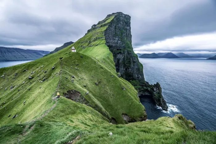 Framed Print : Hiker near the Kalsoy Lighthouse, Faroe Islands, Europe