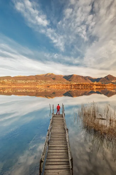 Framed Print : Hiker on the pier looks Alserio lake, Brianza, Parco regionale della Valle del Lambro, Como province, Lombardy, Italy (MR) Framed Print : Hiker on the pier looks Alserio lake, Brianza, Parco regionale della Valle del Lambro, Como province, Lombardy, Italy (MR)