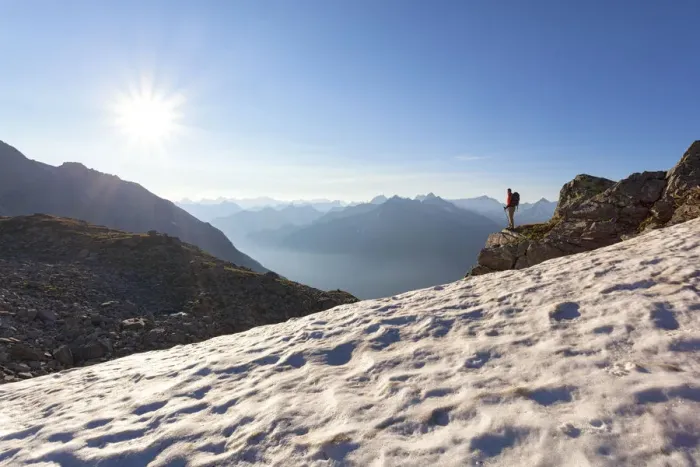 Framed Print : A hiker on the snowfield under the summit of Peterskopfl, Zillertal Alps