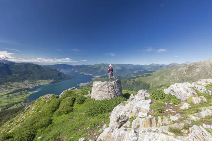 Framed Print : Hiker on summit of Monte Berlinghera looks towards Lake Como, Sondrio province, Lombardy Framed Print : Hiker on summit of Monte Berlinghera looks towards Lake Como, Sondrio province, Lombardy