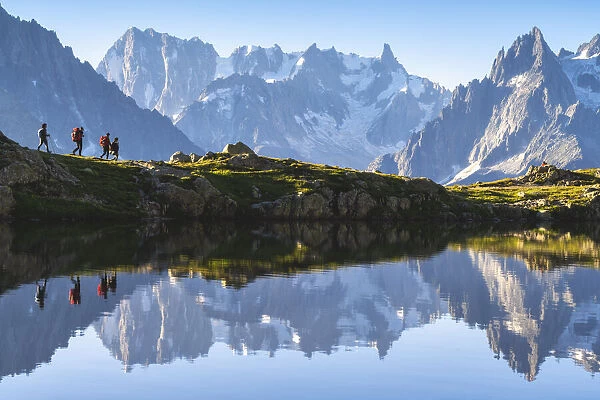 Hikers at Lac des Cheserys in Chamonix Valley, Chamonix Mont Blanc, Haute-Savoie, France