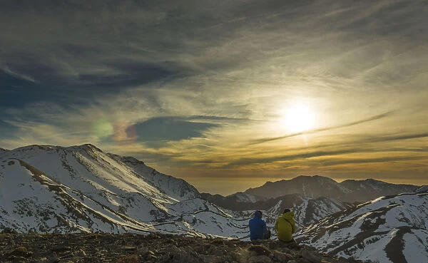 Hikers looking at the sunset in Lefka Ori mountain range, Crete, Greece