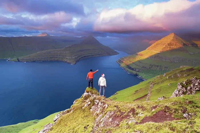 Framed Print : Two hikers on top of a rock admiring the fjord of Funningur at sunrise, Eysturoy island, Faroe islands, Denmark (MR) Framed Print : Two hikers on top of a rock admiring the fjord of Funningur at sunrise, Eysturoy island, Faroe islands, Denmark (MR)