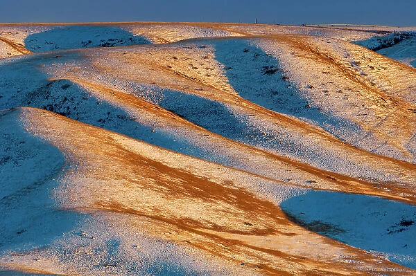 Hills in the valley of the Oldman River in winter at sunset Oldman Valley, Alberta, Canada