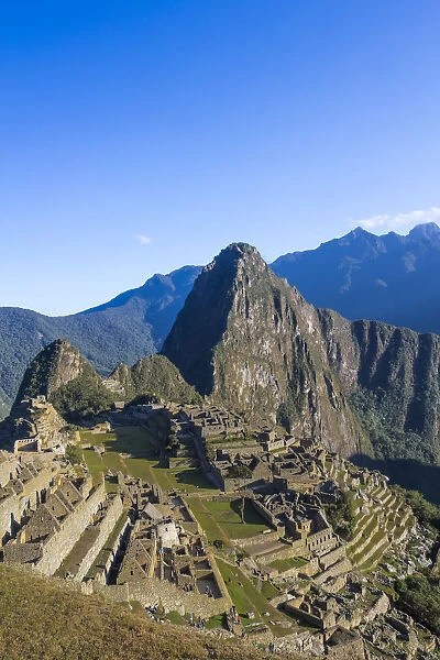 Historic ancient Incan Machu Picchu on mountain in Andes, Cuzco Region, Peru